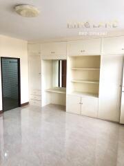 Spacious bedroom with built-in wardrobe and vanity table