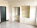 Spacious bedroom with built-in wardrobe and vanity table