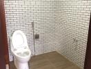 Modern bathroom with white subway tiles and a toilet