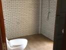 Bathroom with tiled walls and toilet