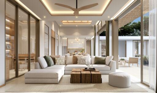 Modern and spacious living room with large windows and comfortable seating.