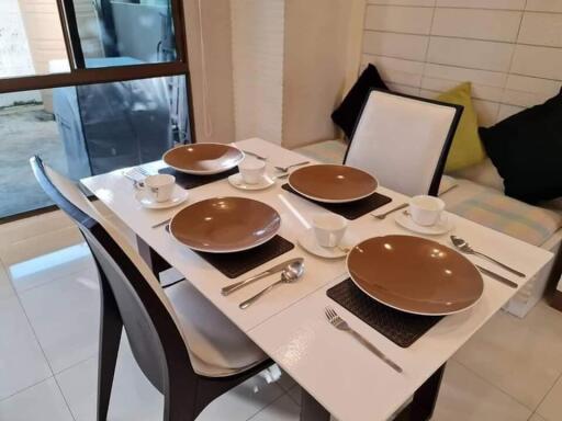 Dining area with table set for four