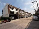 Residential townhouse complex with multiple units and street view