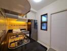 Modern kitchen with stainless steel appliances and comprehensive cabinetry