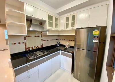 Modern kitchen with stainless steel appliances and tiled backsplash