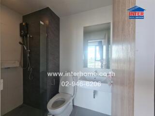 Modern bathroom with shower, toilet, and sink