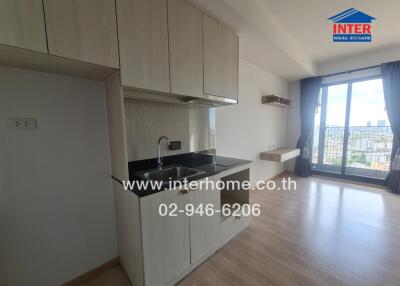 Kitchen with cabinets, sink, and a view of the city