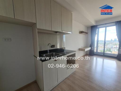 Kitchen with cabinets, sink, and a view of the city