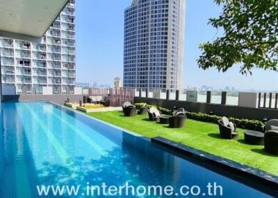 Outdoor view with swimming pool and garden area