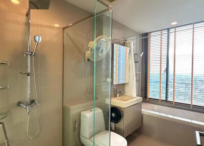 Modern bathroom with shower, bathtub, and toilet