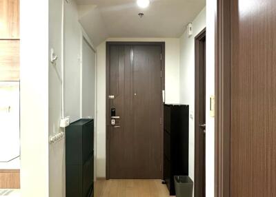 Hallway with wooden floor and doors