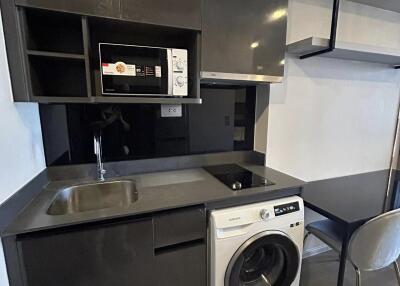 Modern kitchen with appliances and built-in shelving