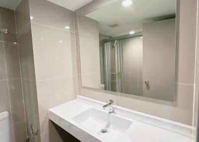 Modern bathroom with large mirror and sink