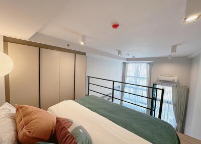 Modern split-level bedroom with large windows and natural light