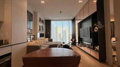 Modern living room with large windows and city view