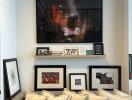 Cozy living room area with a comfortable couch and framed artwork on the wall.