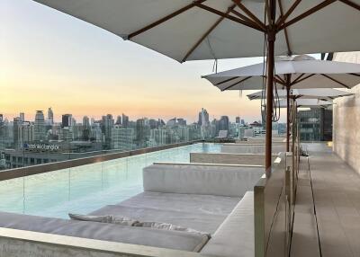 Rooftop pool area with city skyline view