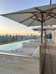 Rooftop pool area with city skyline view