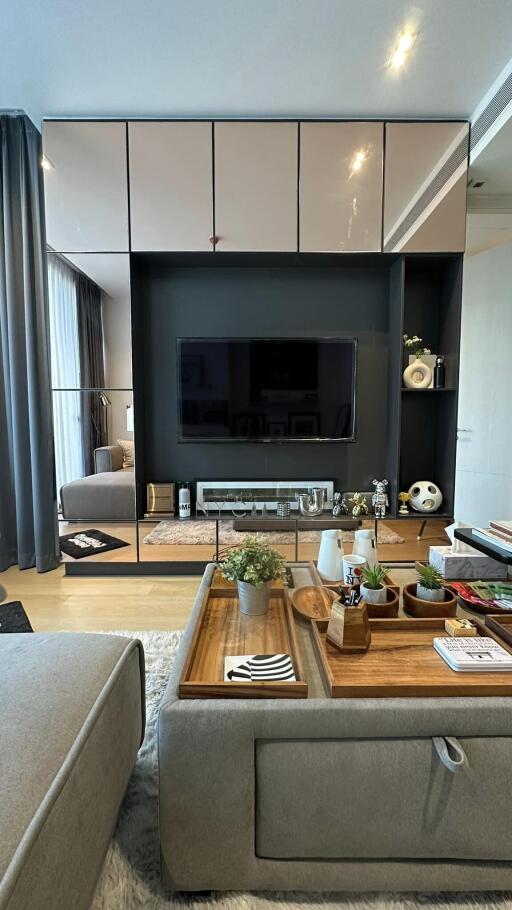 Modern living room with wall-mounted TV and decorative shelving