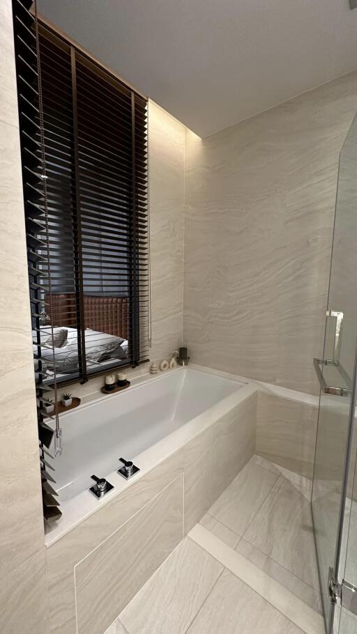 Modern bathroom with bathtub and glass shower