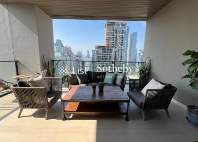 Modern balcony with outdoor furniture and city view