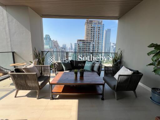 Modern balcony with outdoor furniture and city view