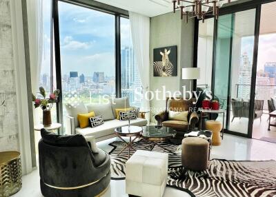 Spacious modern living room with large windows and city view