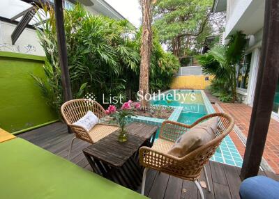 Outdoor seating area with a swimming pool