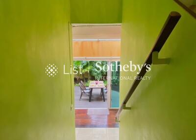 Staircase entrance leading to a dining area