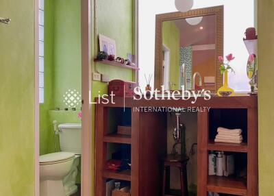 Well-organized bathroom with green walls