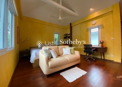 Bright bedroom with yellow walls and modern furniture