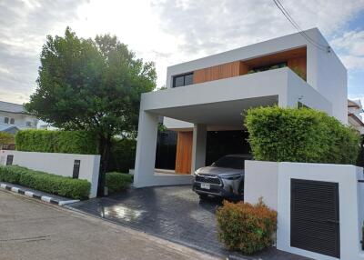 Modern house exterior with carport