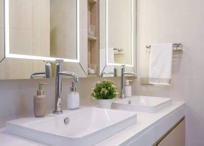 Modern bathroom with dual sinks and mirrors