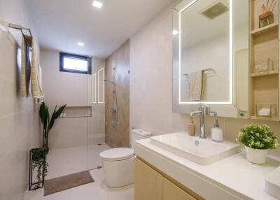 Modern bathroom with large mirror and glass-enclosed shower