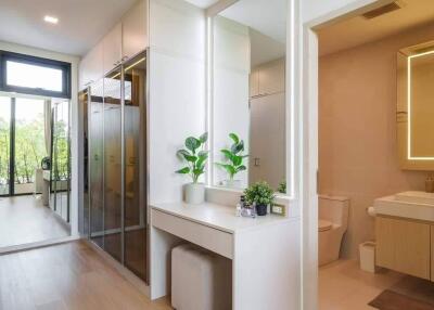 Modern dressing room with full-length mirrors and bathroom