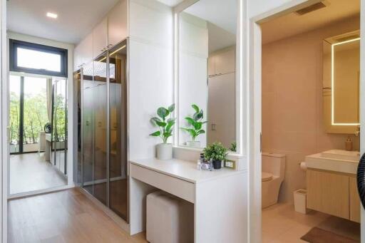 Modern dressing room with full-length mirrors and bathroom