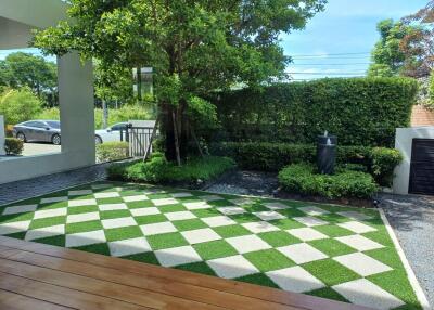 Well-maintained garden with checkered lawn