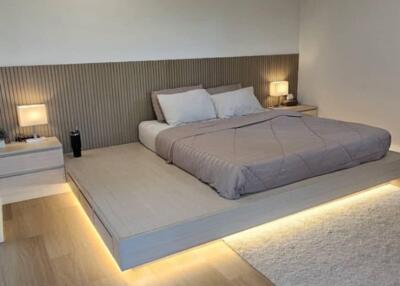 Modern bedroom with platform bed and ambient lighting