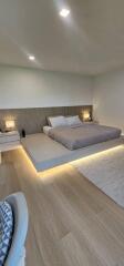 Modern bedroom with platform bed and ambient lighting