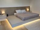 Modern bedroom with platform bed and ambient lighting