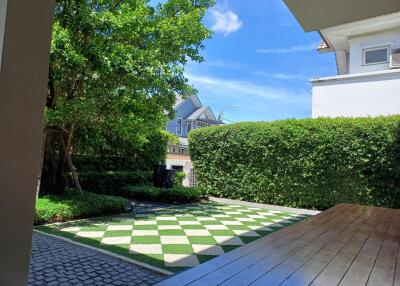 Outdoor garden with paved areas and lush greenery