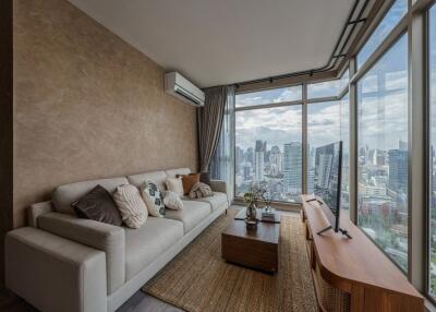 Modern living room with large windows and city view