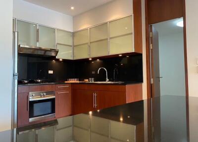 Modern kitchen with sleek cabinetry and built-in appliances