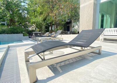 Outdoor poolside lounging area