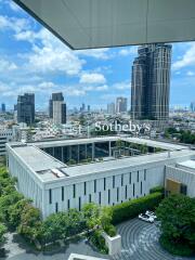 Aerial view of a modern cityscape with high-rise buildings and lush greenery.