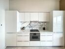 Modern white kitchen with integrated appliances and marble backsplash