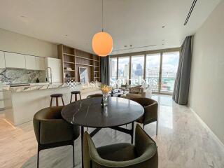 Modern kitchen and dining area with city view