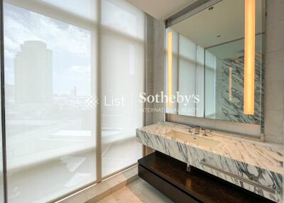 Modern bathroom with marble sink and large window