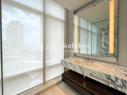 Modern bathroom with marble sink and large window