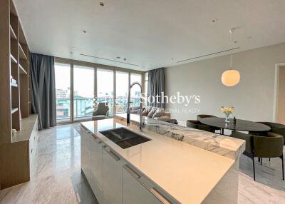 Modern living area with kitchen island and dining space